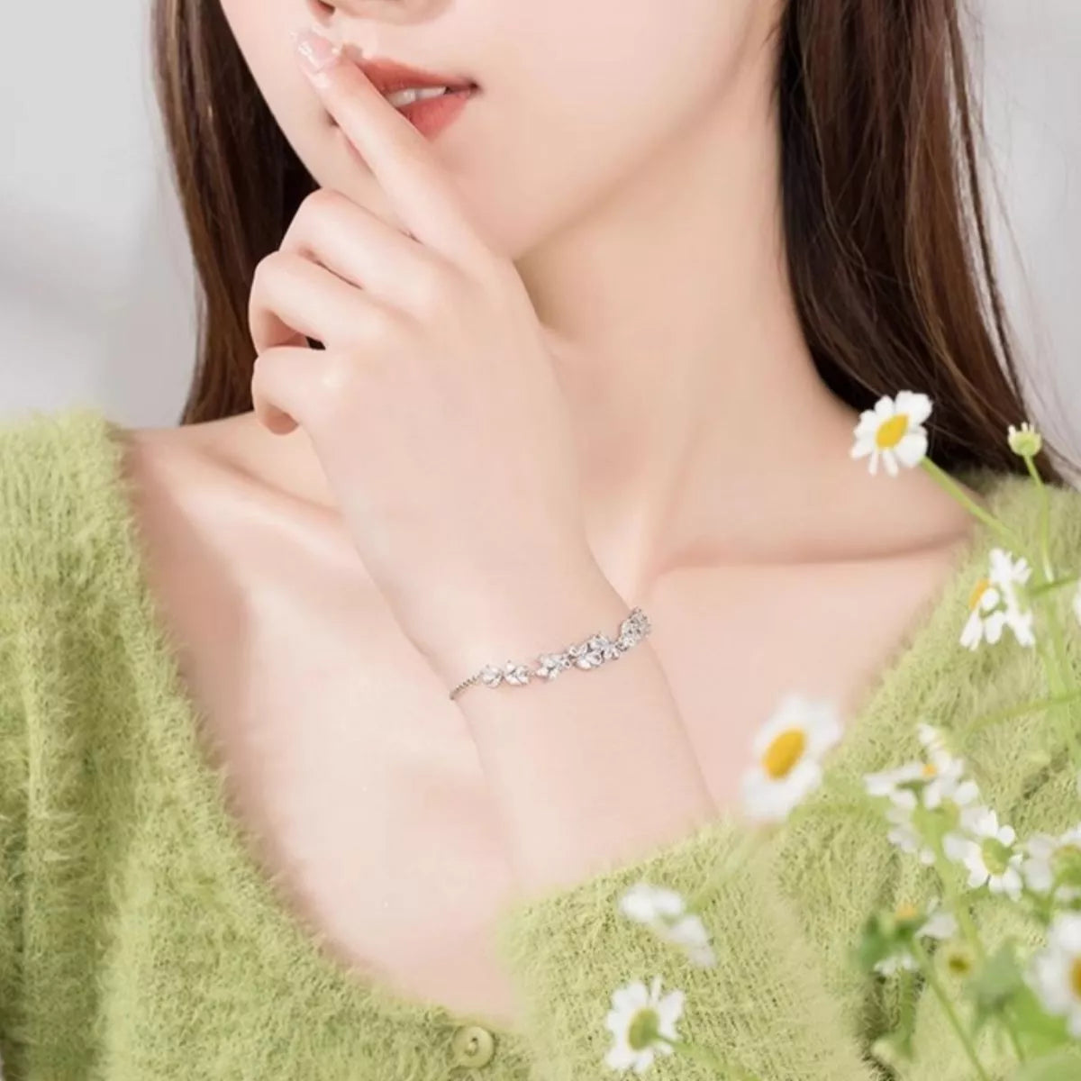 Zircon wisteria bracelet with small linked stones, worn near the collar