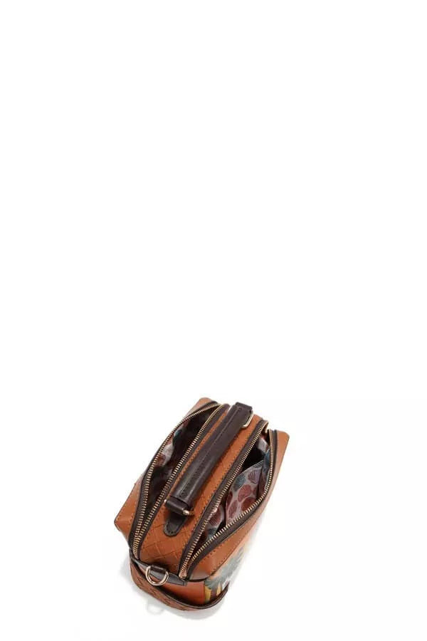 Mini satchel side view showing zipper trim and interior lining