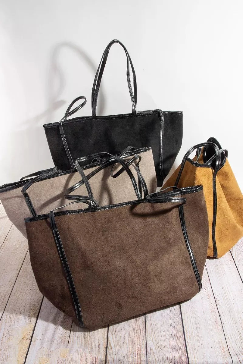 Set of suede tote bags with faux-leather trim in black, taupe, and tan/brown.