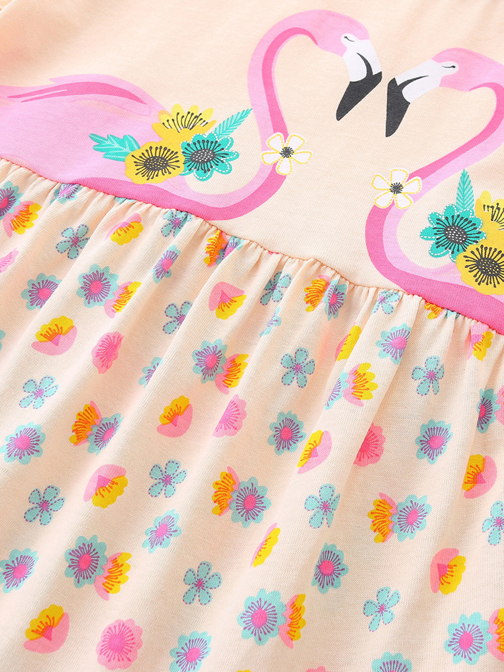 Eggshell dress close-up: flamingo print and multicolor floral tiered hem