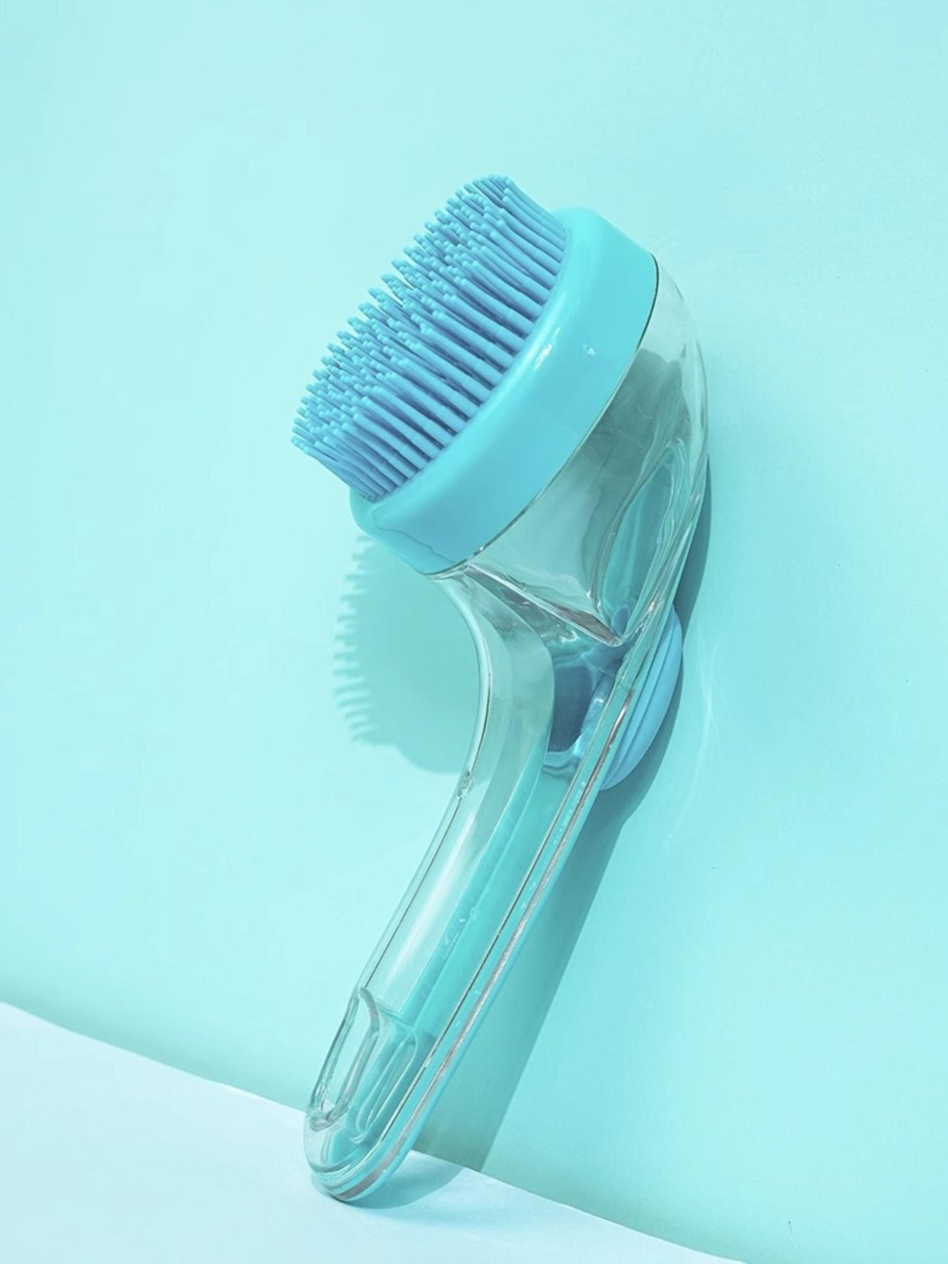 Light blue Soft Pet Shower Brush, round bristle head with clear ergonomic handle