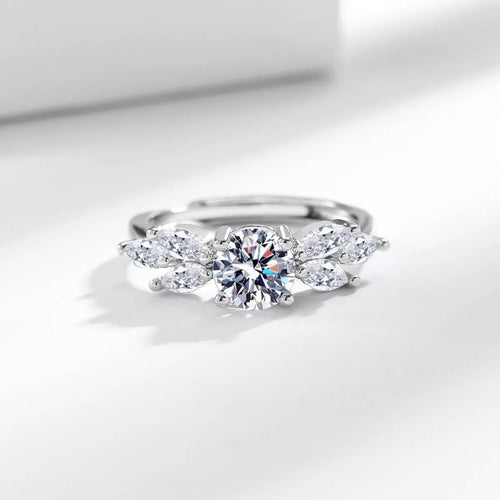 Silver 925 moissanite ring with central round stone and side marquise accents, open band