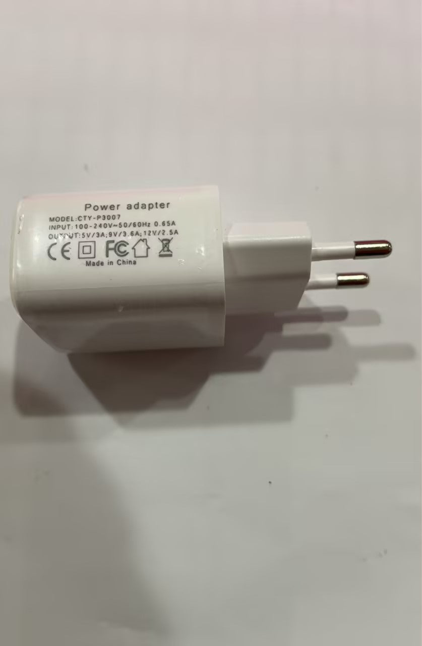 Light gray power adapter with two-prong plug, model and output specs printed.