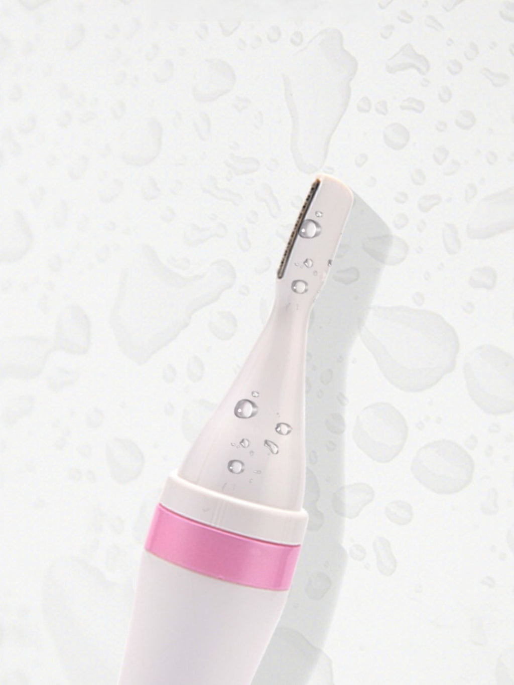 Pink 4-in-1 Nose Hair Trimmer blade head with visible water droplets