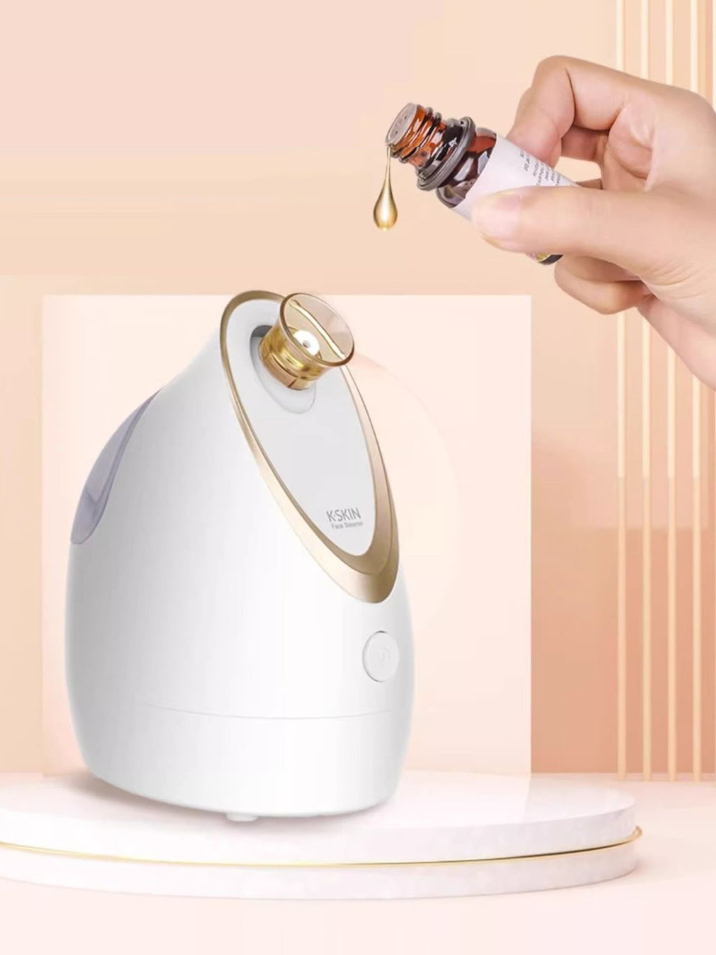 White facial steamer with gold nozzle, ready to release steam