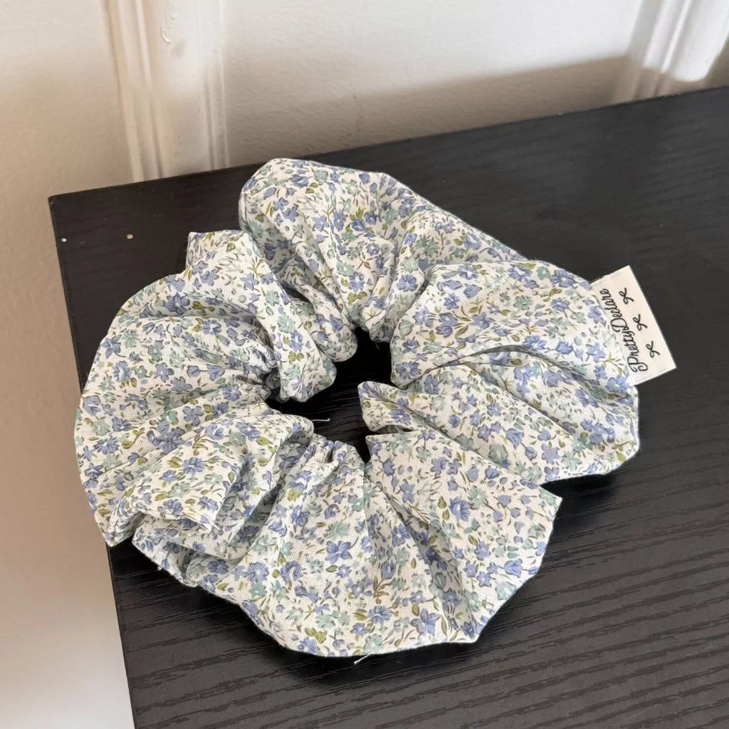 Light blue floral hair scrunchie with gathered fabric