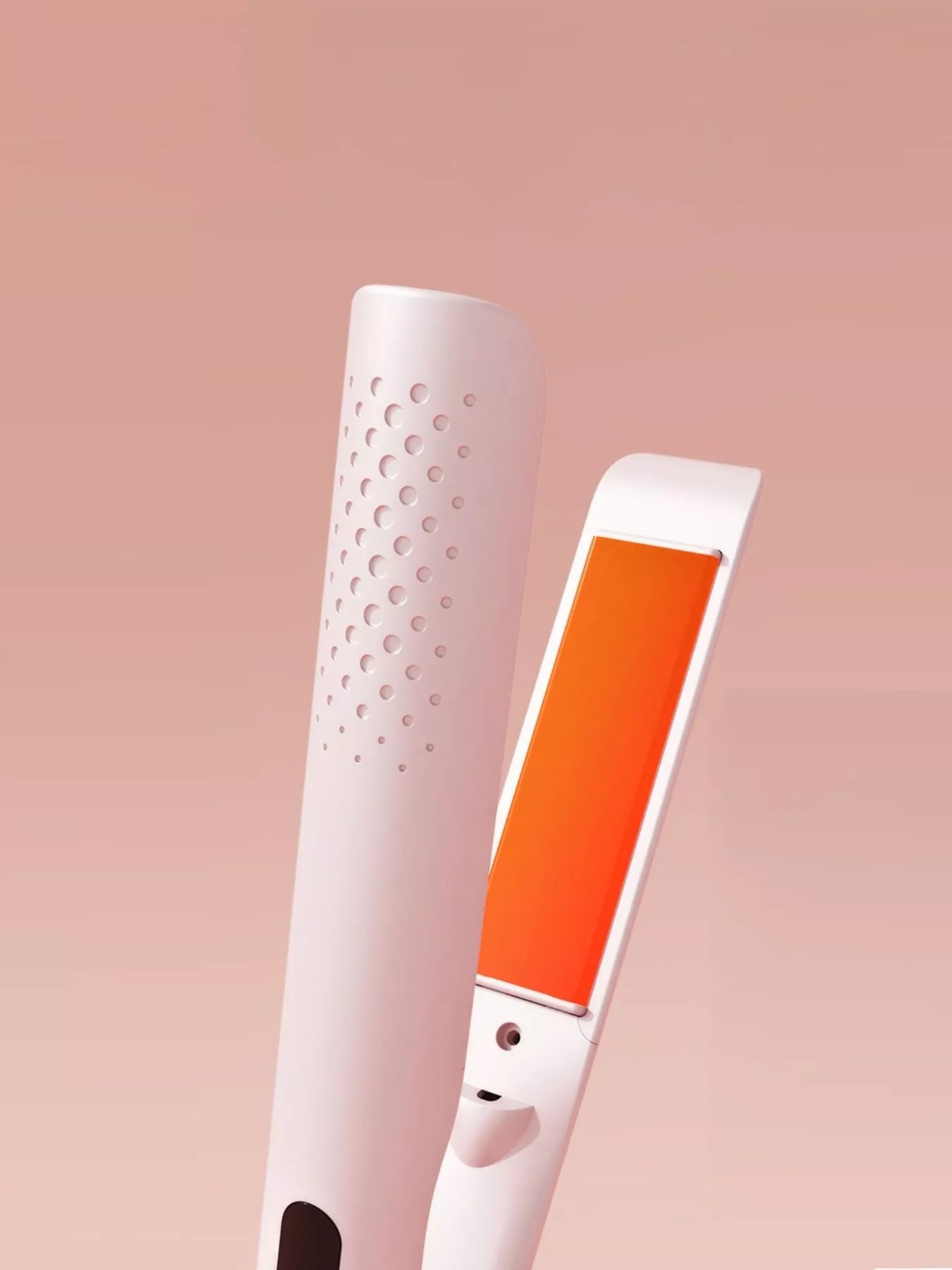Blush Pink hair straightener with heated flat plates and vented barrel