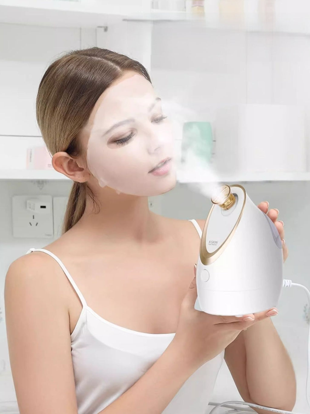 White facial steamer held near face, releasing visible steam
