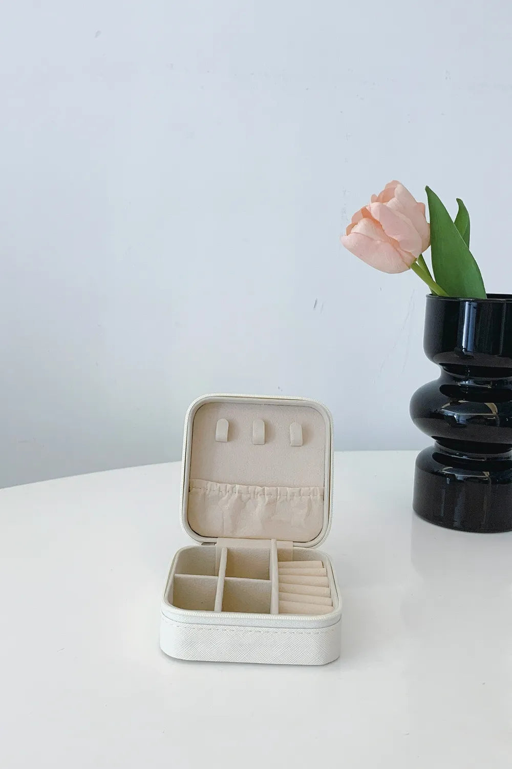 White PU leather square jewelry box, open with earring slots and inner compartments