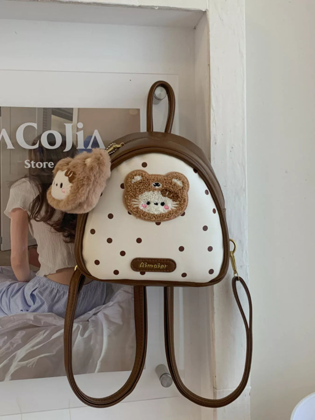 Brown cartoon bear mini backpack with fluffy bear keychain and dotted front panel
