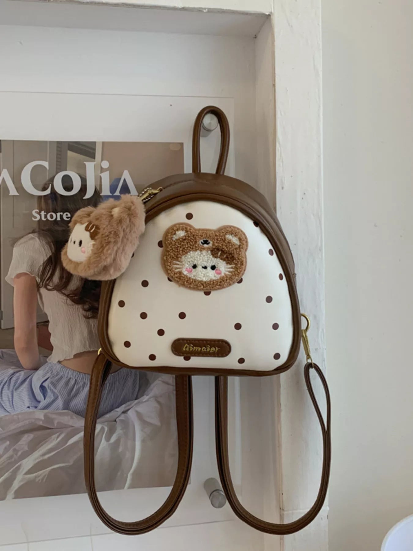 Brown cartoon bear mini backpack with fluffy bear keychain and dotted front panel