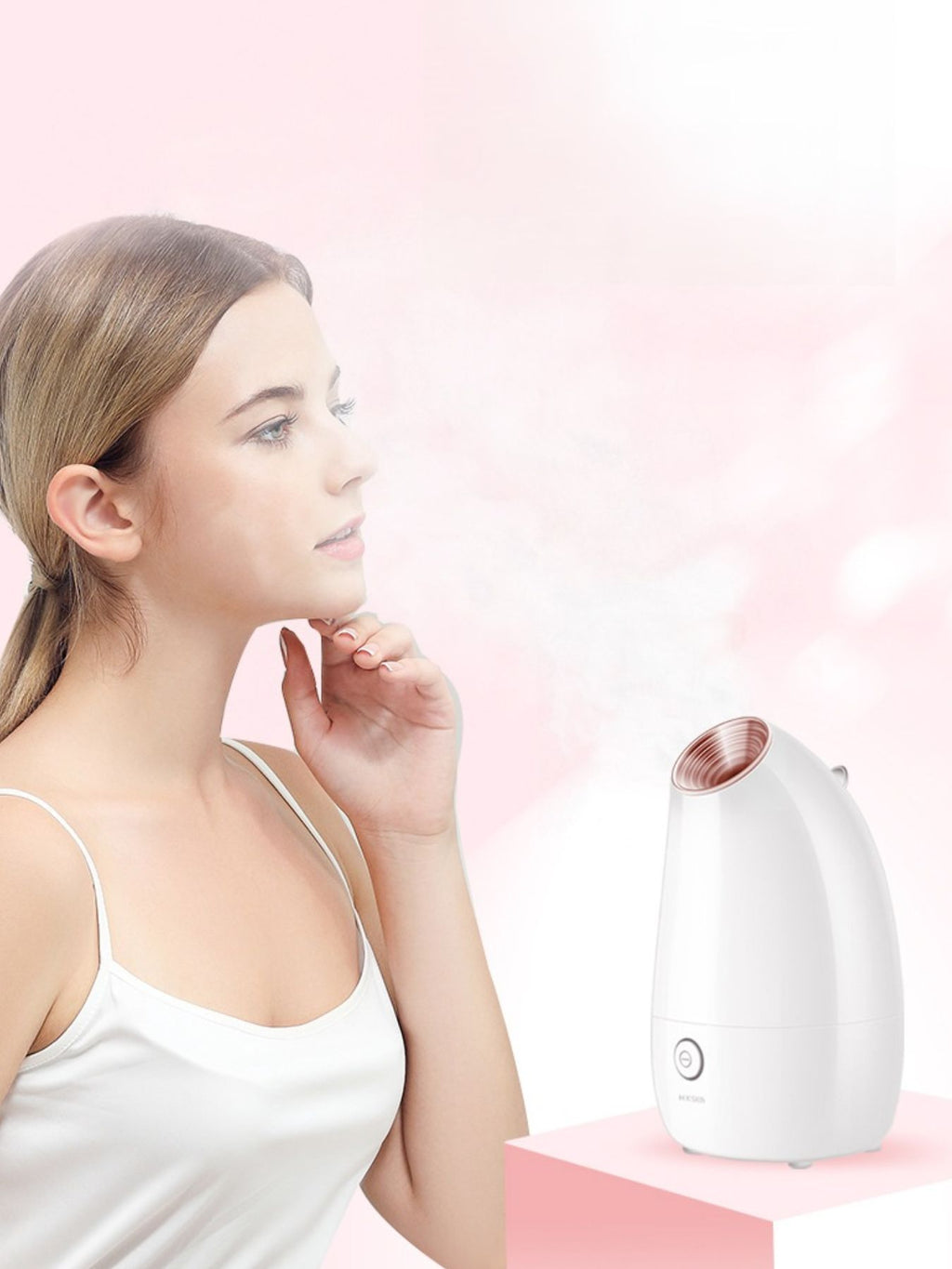 White facial steamer with rose-gold top vent; handheld use