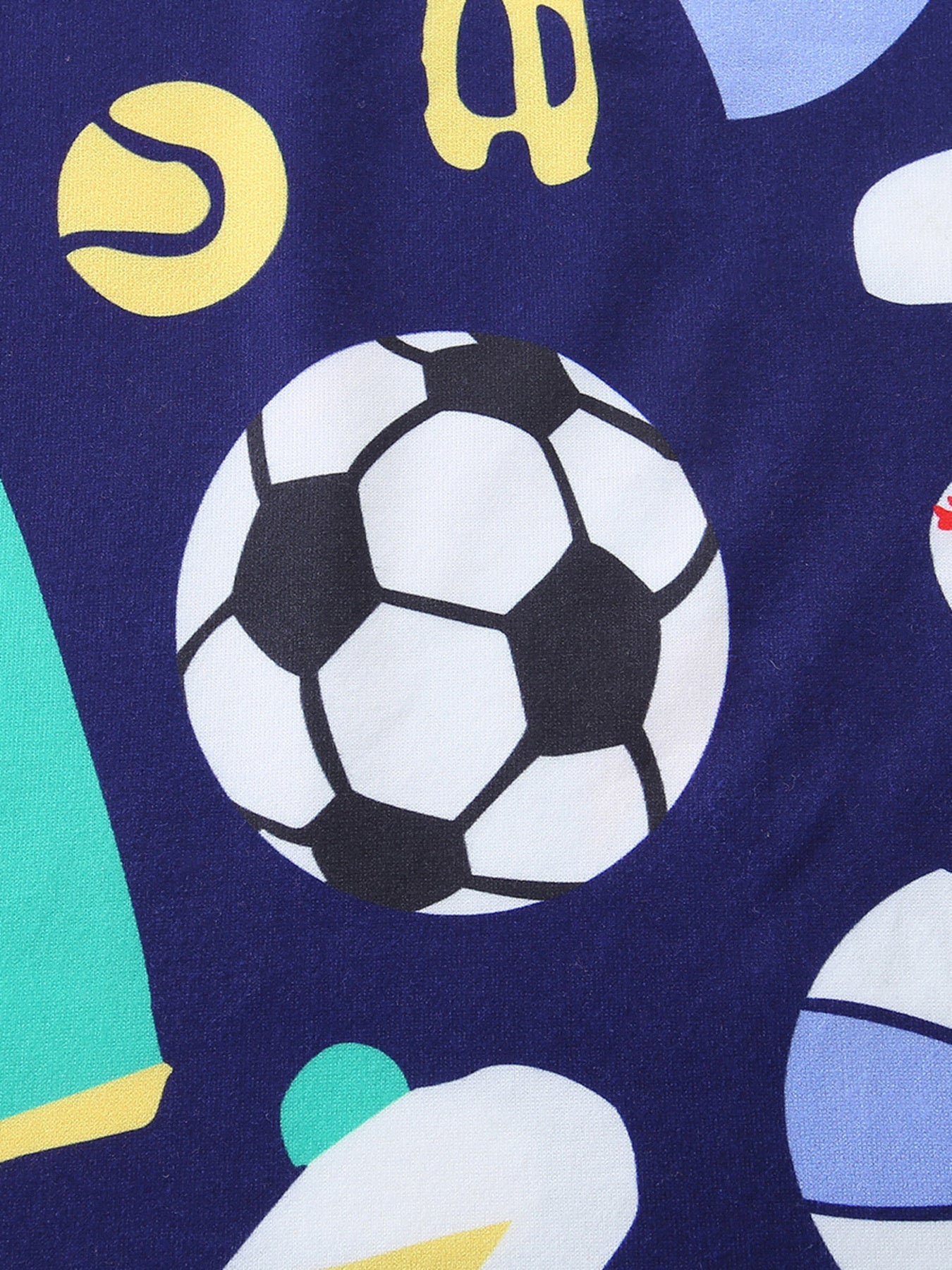 Close-up of navy sports print with a large soccer ball graphic