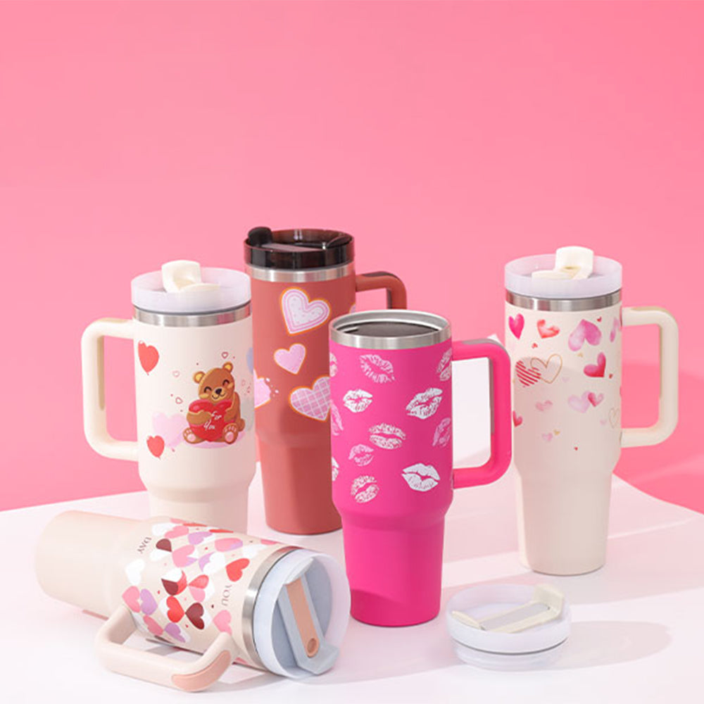Assorted 40 oz insulated tumblers with handles, straws, and lids—heart designs
