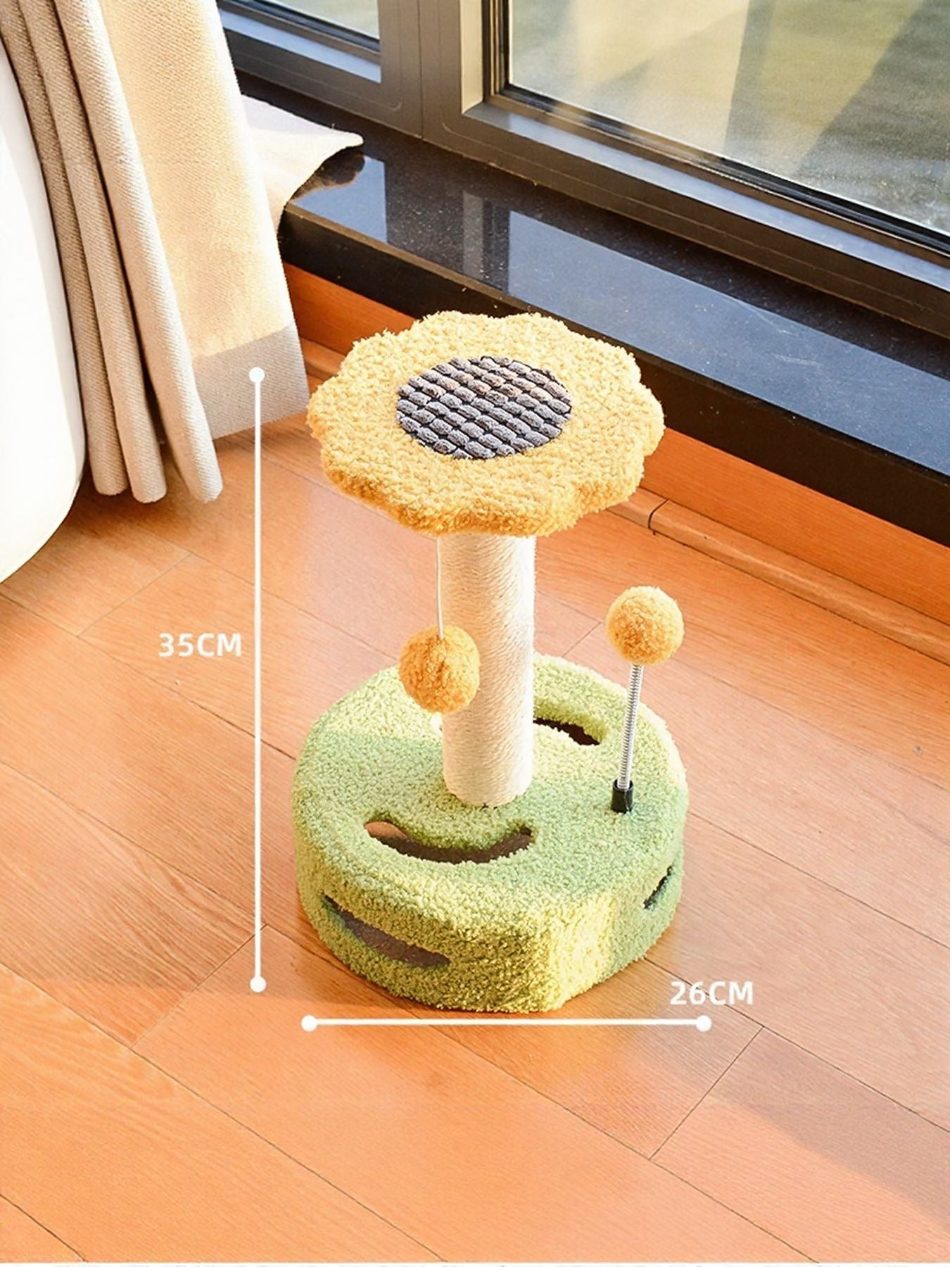 Cat scratching post with dangling balls in yellow and green, size shown with measurement lines