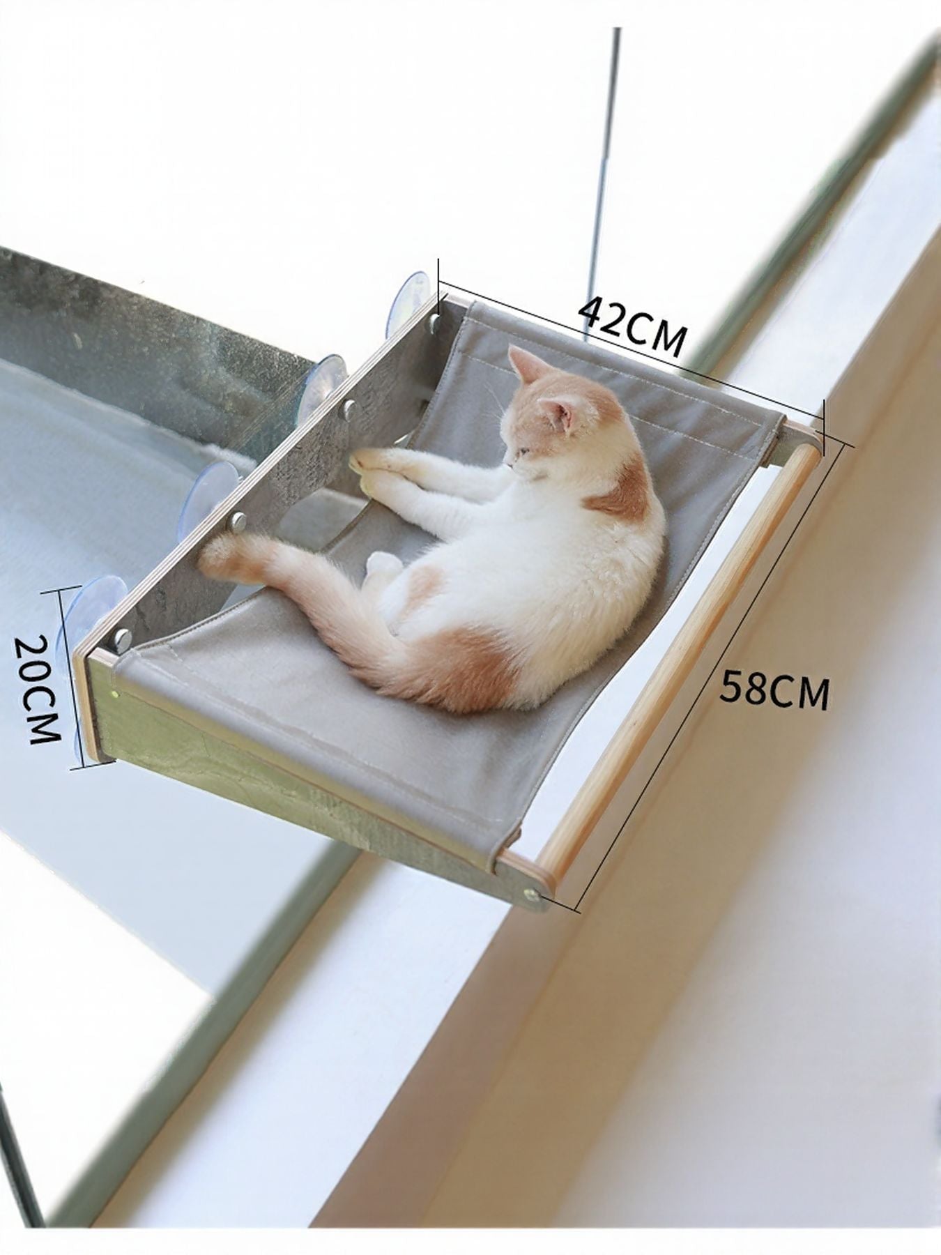 Window-mounted cat hammock bed with grey cushion and cat sleeping inside, size labels