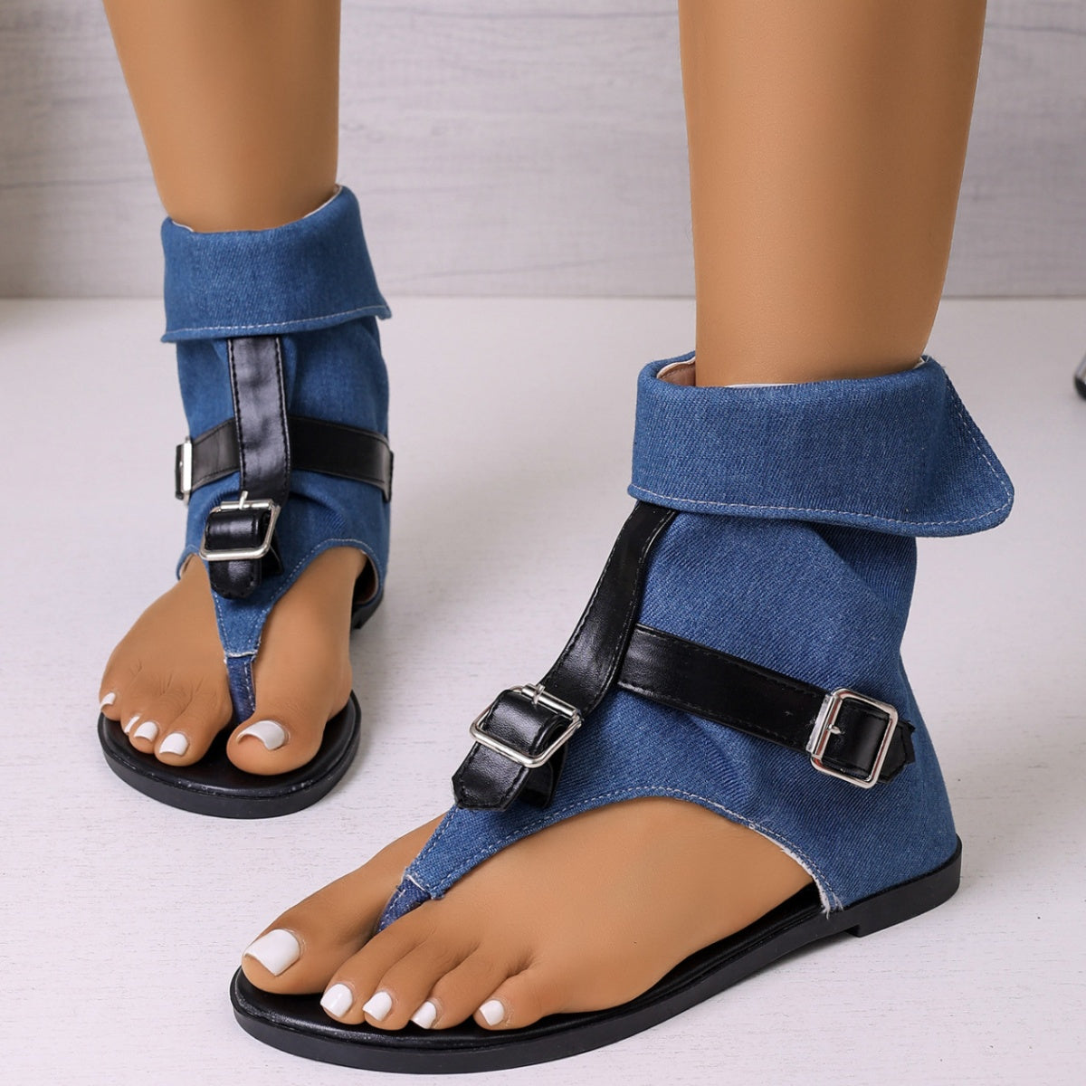 Blue toe-post sandals with adjustable buckle ankle straps and open toe, flat sole