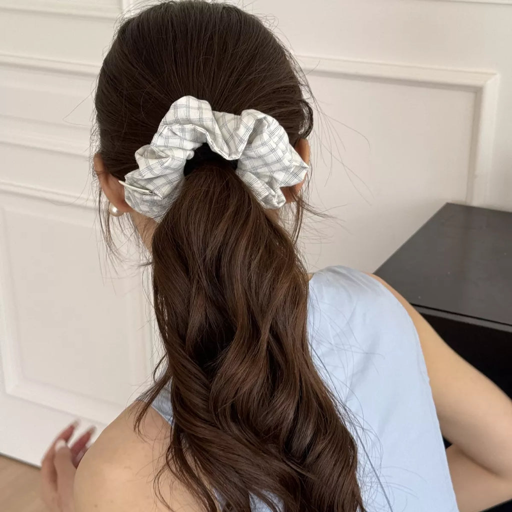 White plaid hair scrunchie on brown hair ponytail
