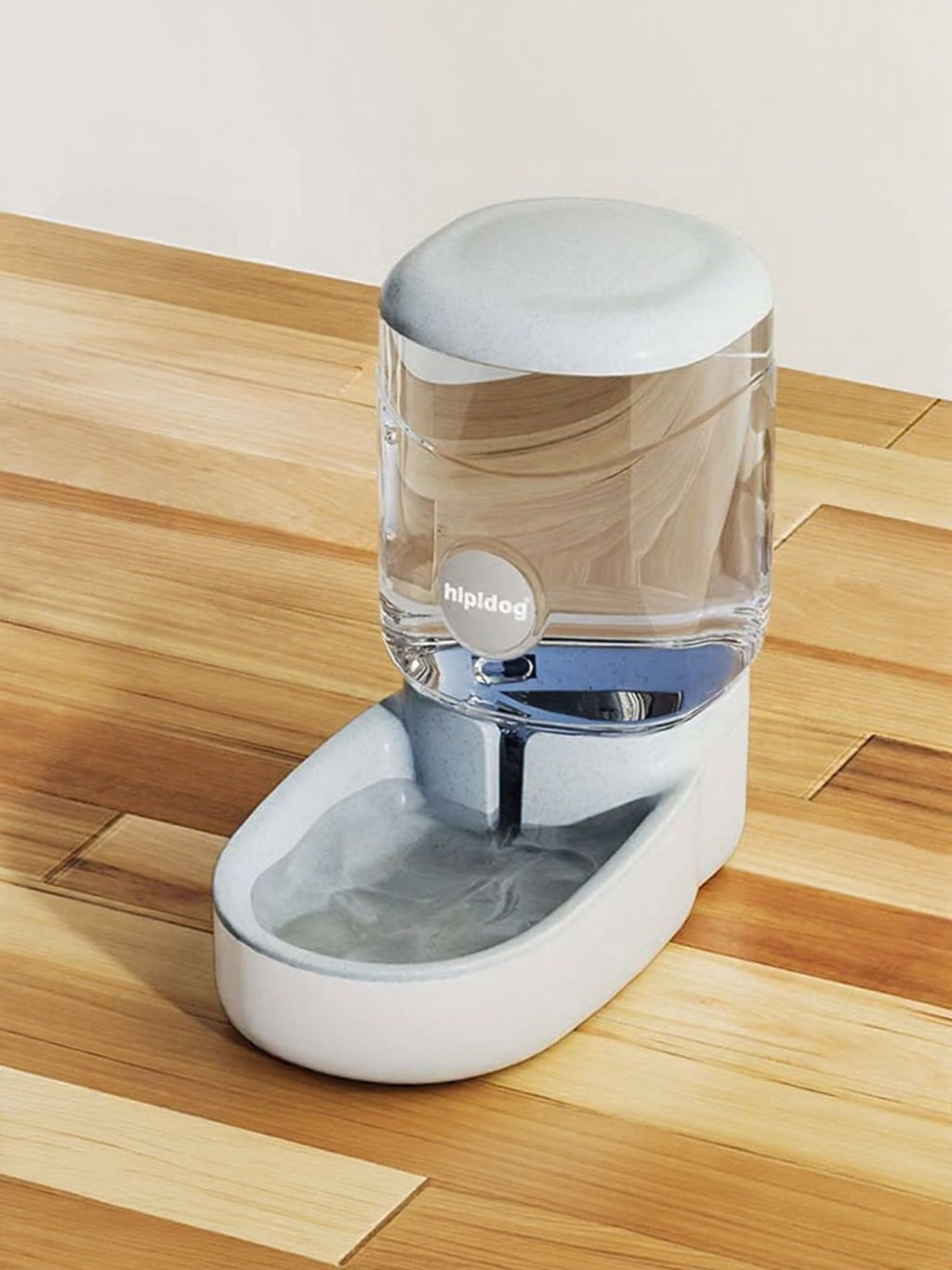 Light gray automatic water dispenser with clear tank, spout, and white reservoir base