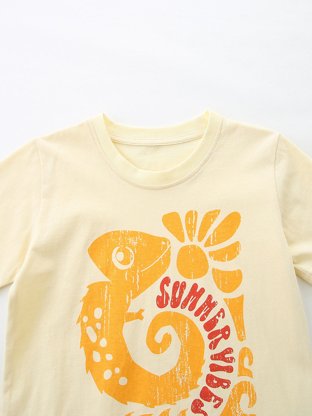 Pastel Yellow kids tee with large orange and red “Sunshine Days” graphic