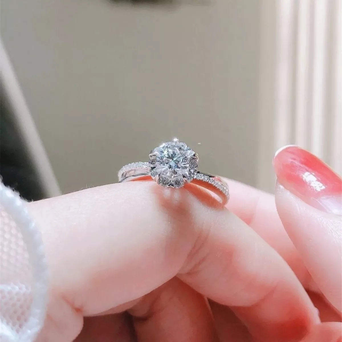 Sterling silver moissanite ring with round center stone and split-shank sparkle