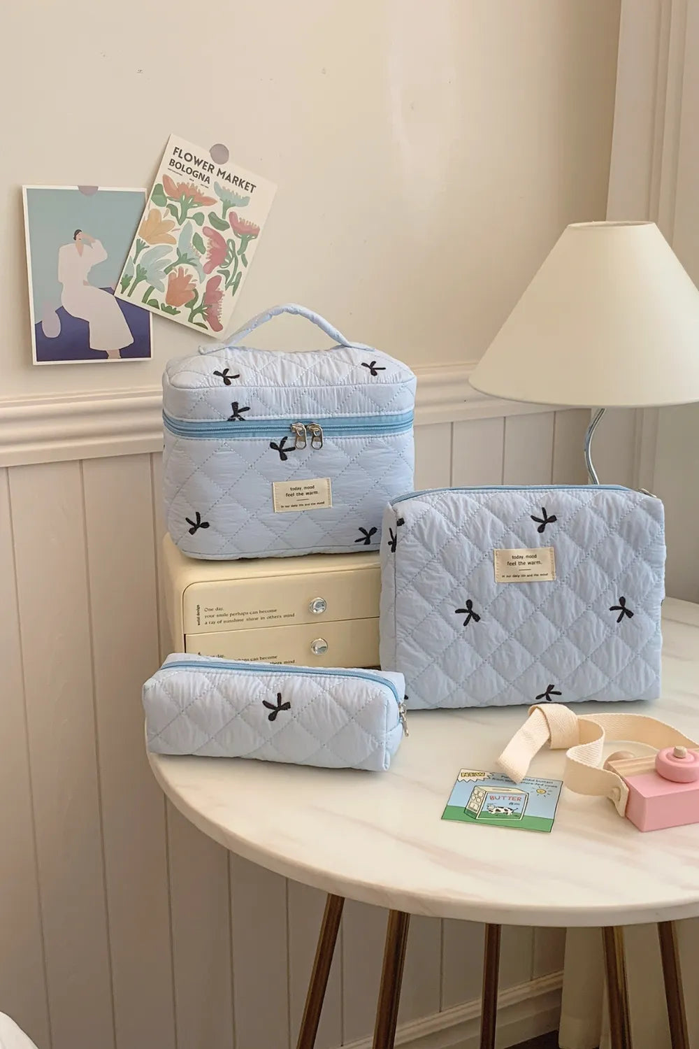 Light blue quilted storage set with bow print: large zip cube, medium and small zip pouches