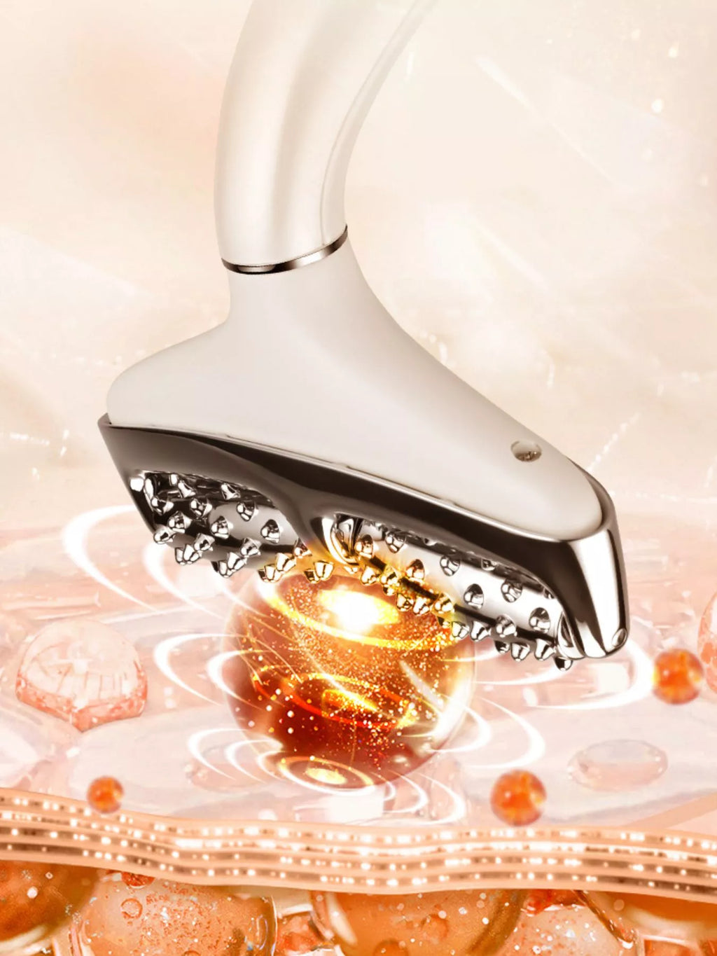 Close-up of white massager roller head with glowing heating lights