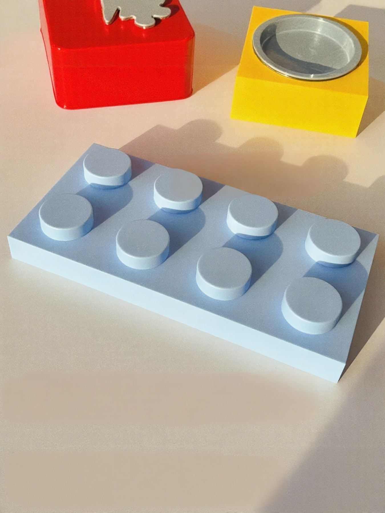 Light blue building-block style base with multiple small gray pet bowls