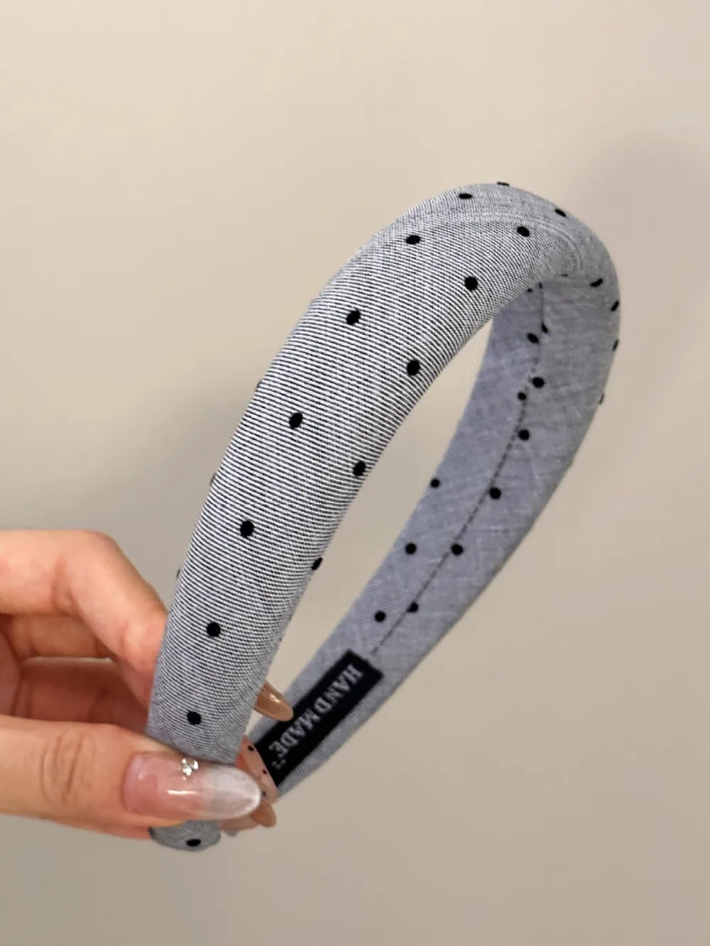 Dark gray polka dot wide polyester headband with black dots