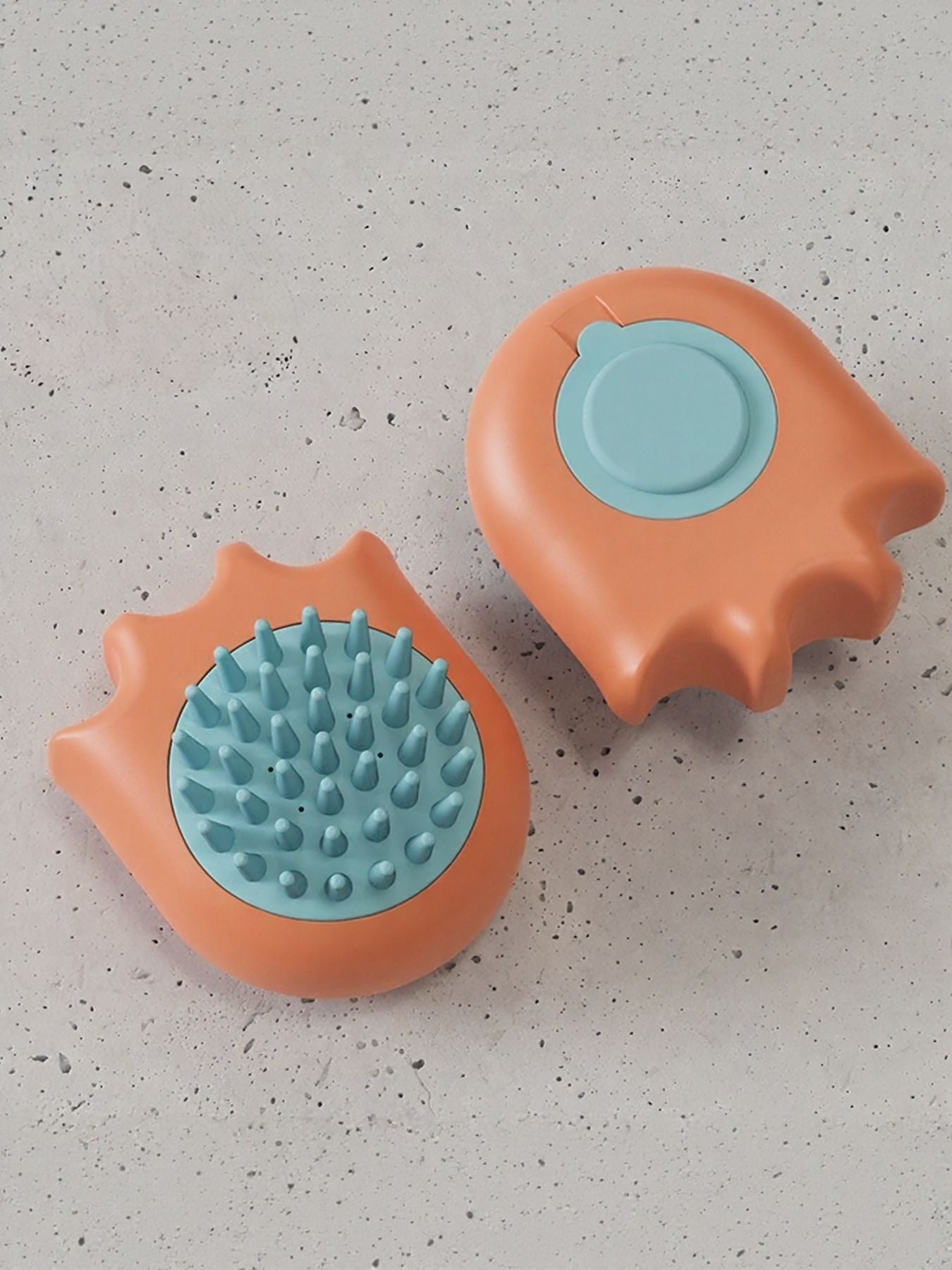 Orange bath brush set: two orange grooming pads with light-blue spiky scrub bristles