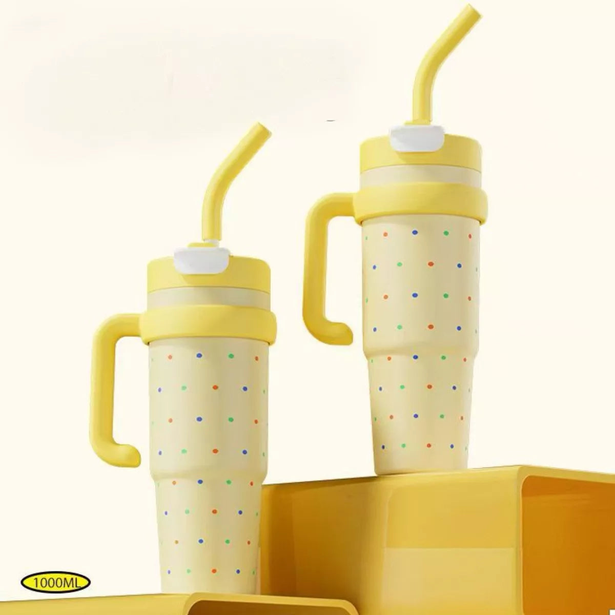 Two yellow 1000ML water bottles with straw, handles, and flip-top lids