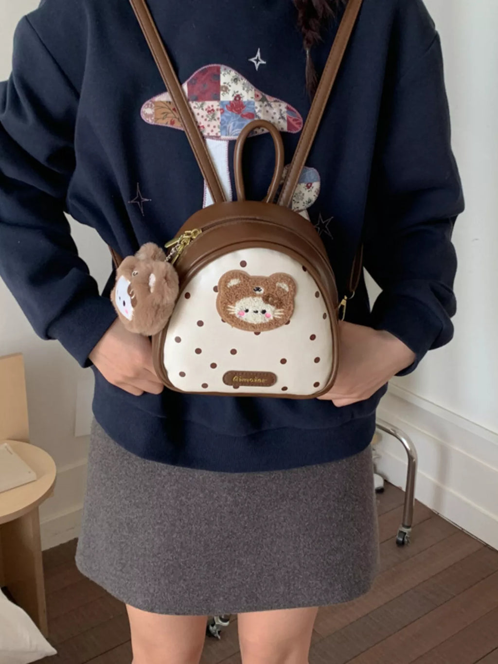 Cartoon bear mini backpack, brown with bear patch and plush charm; adjustable shoulder straps