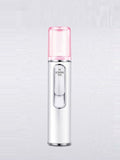 Portable facial mister nano sprayer with clear pink nozzle cap on white body