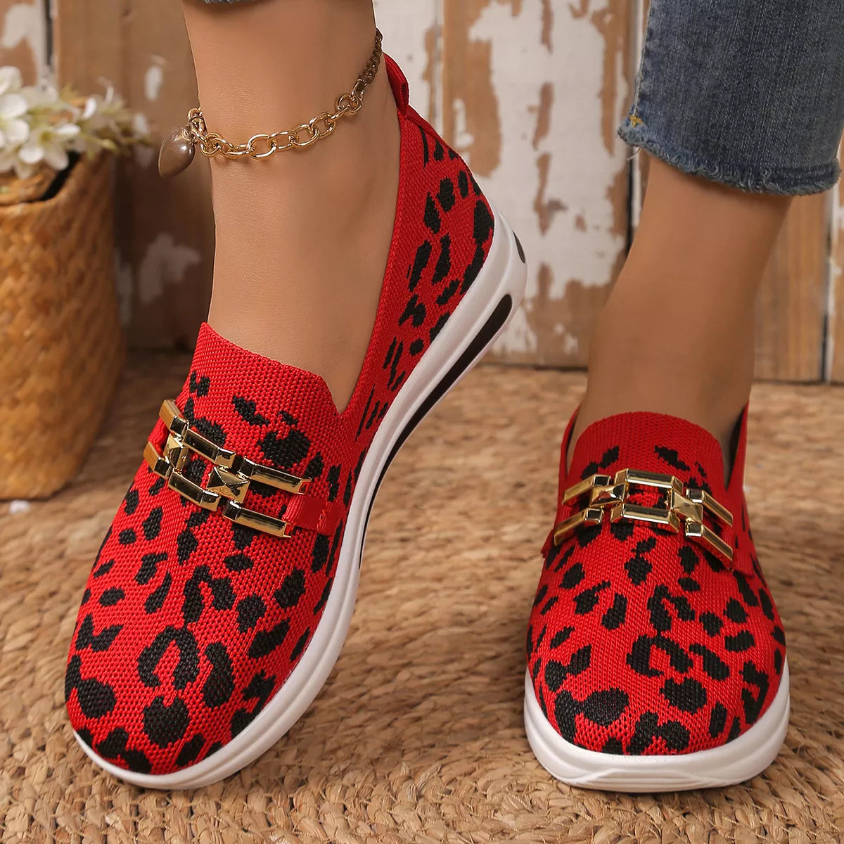 Red leopard mesh slip-on sneakers with gold buckle detail and white platform sole