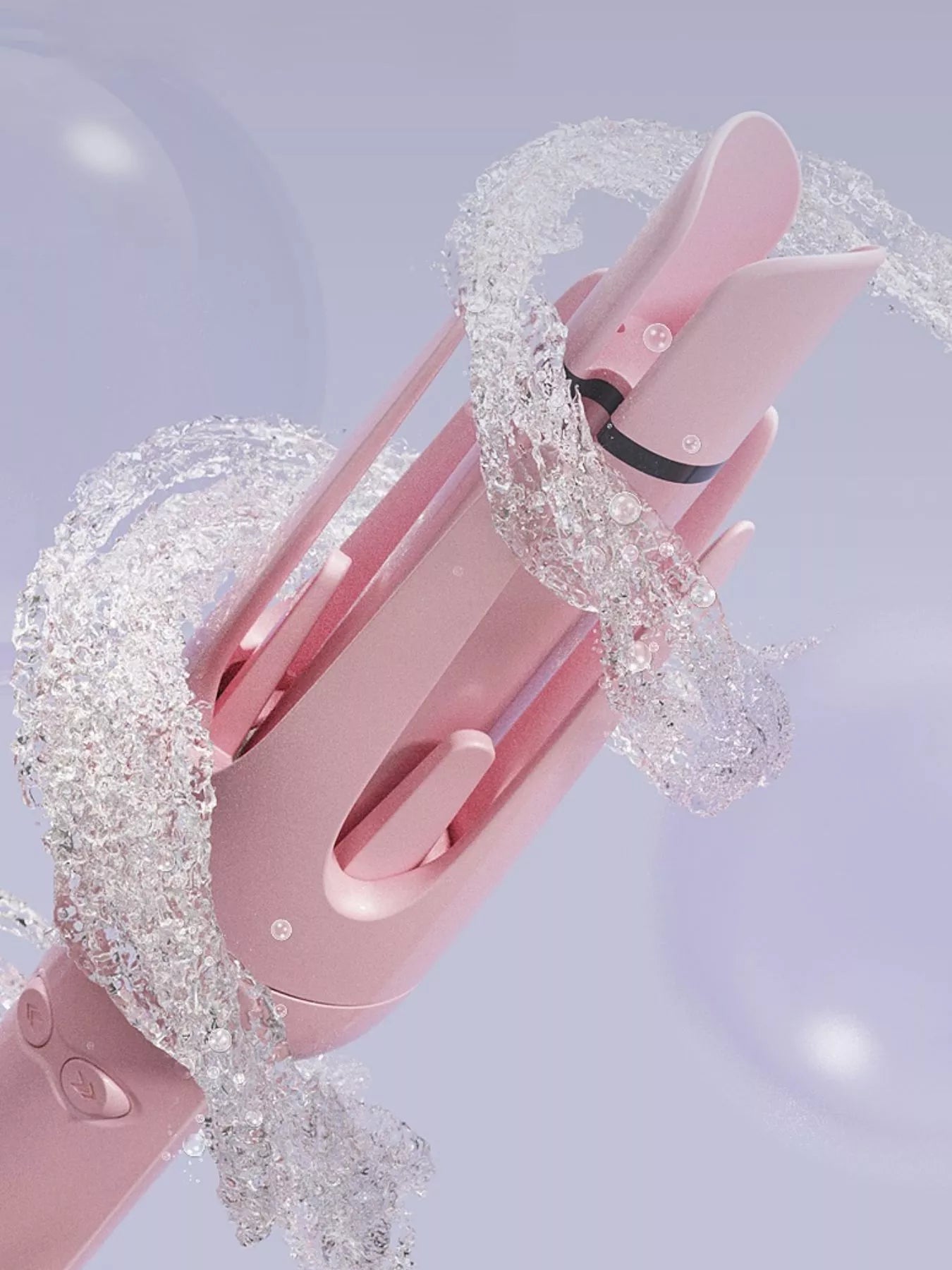 Dusty Pink rotating ceramic hair curler with hair wrapped around the barrel