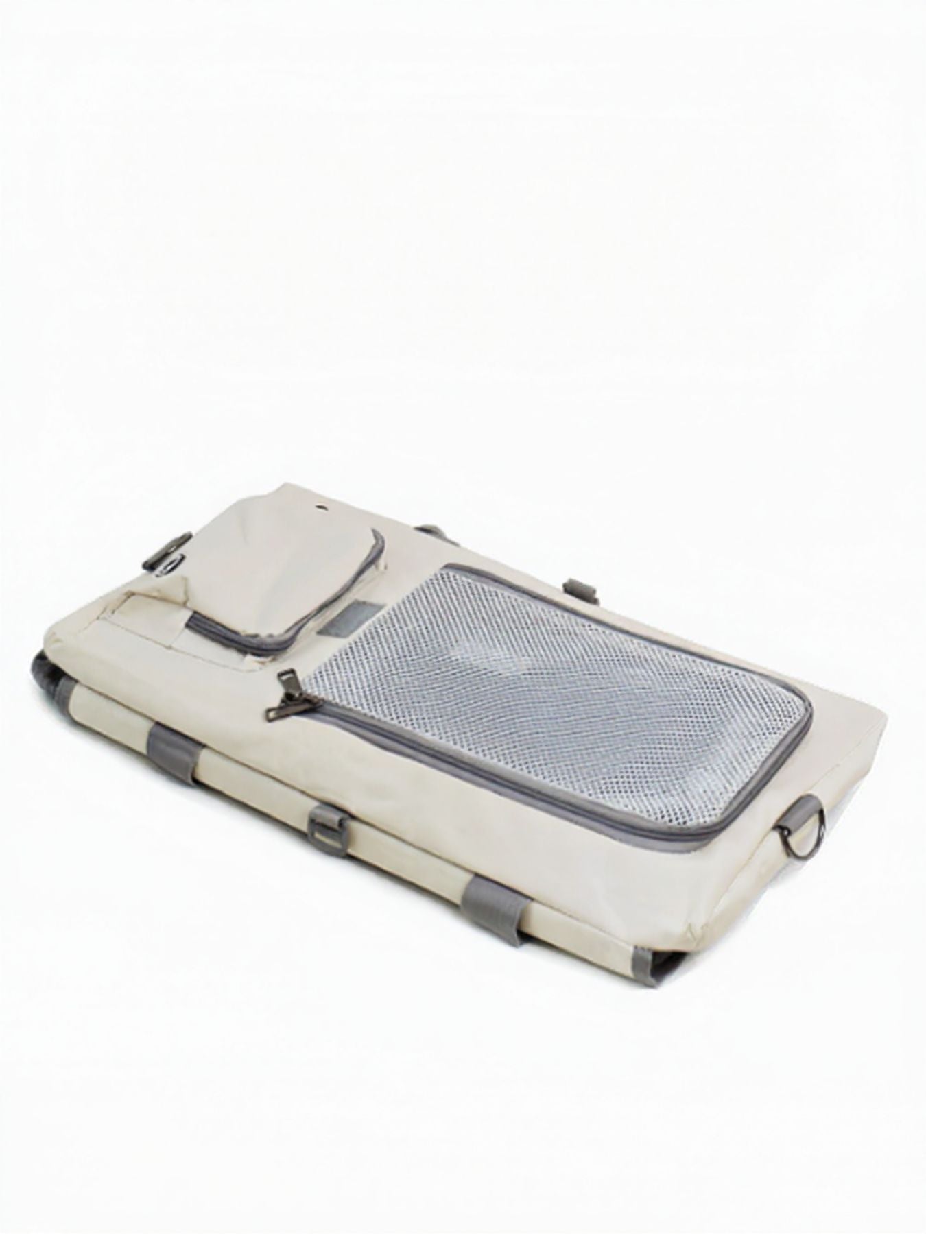 Gray breathable pet carrier bag folded flat, with mesh top insert and zipper closures.