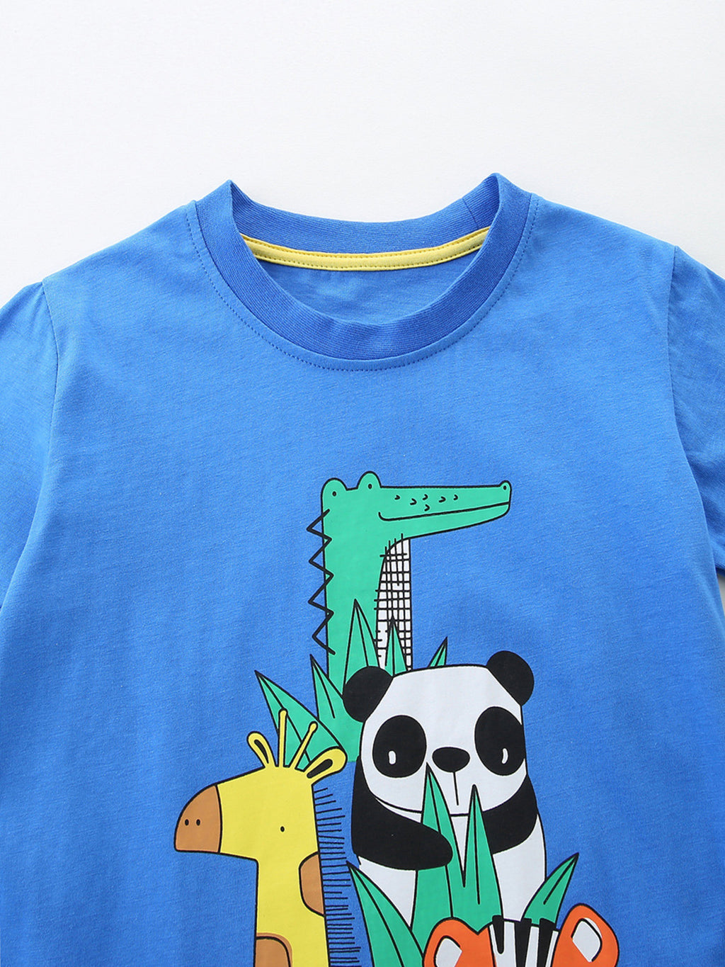Close-up: blue crew neck T-shirt with panda and crocodile illustration