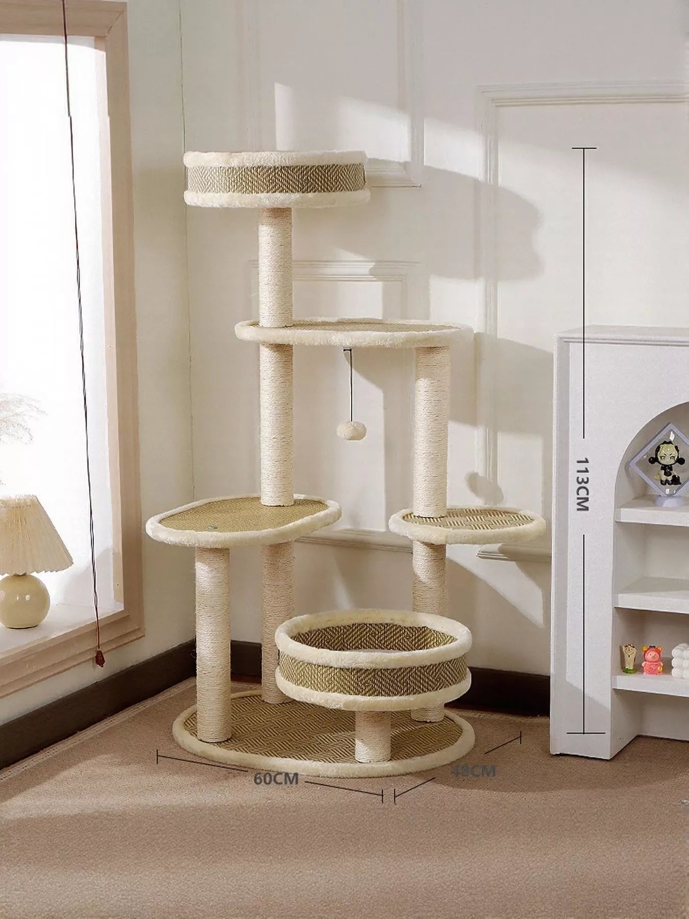 Cream plush cat tree condo with stacked platforms, dangling ball, and sisal scratching pads