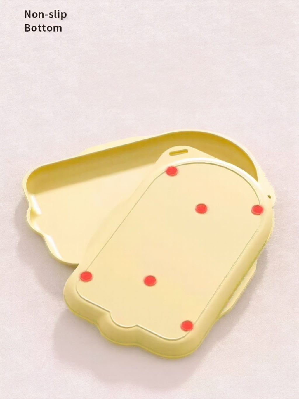 Non-slip pet bowl tray in pastel yellow with removable insert and dotted base