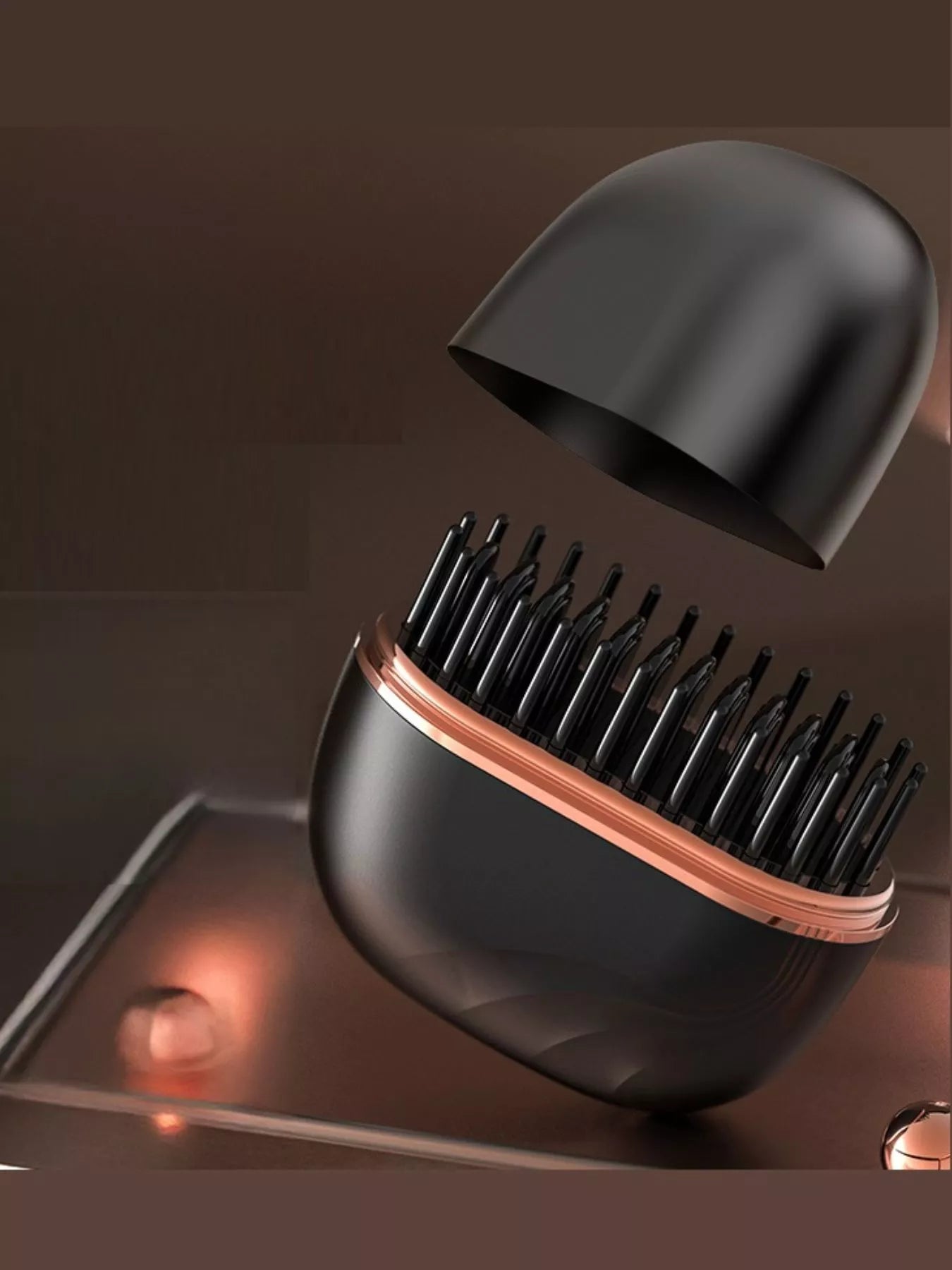 Black portable hair straightening comb with open lid and rose-gold edge
