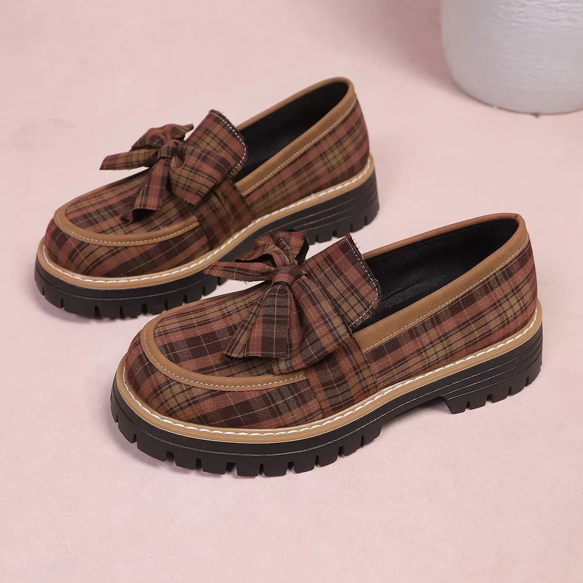 Tan plaid bow decor chunky loafers, twin pair view with black lug sole