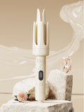 Beige automatic hair curling iron with three vertical barrels and control buttons