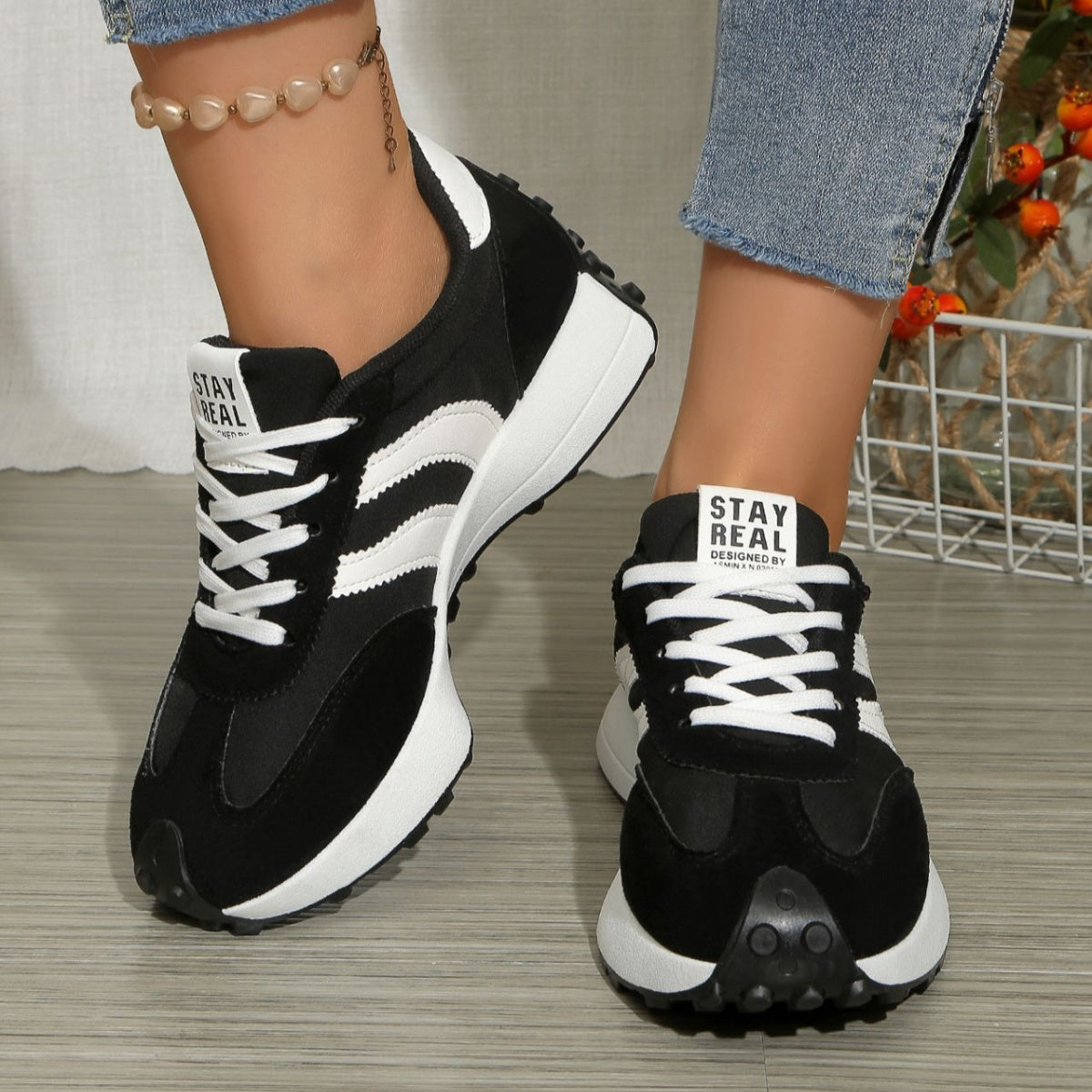 Round toe lace-up sneakers, black upper with white laces and heel branding