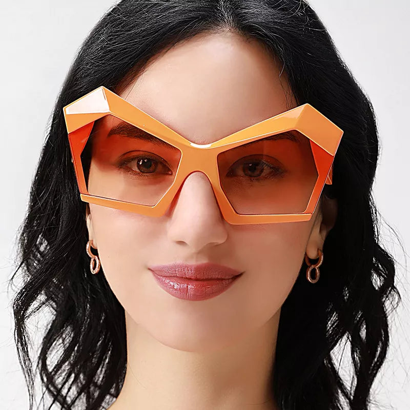 Tangerine oversized geometric sunglasses, centered frontal view with tinted lenses