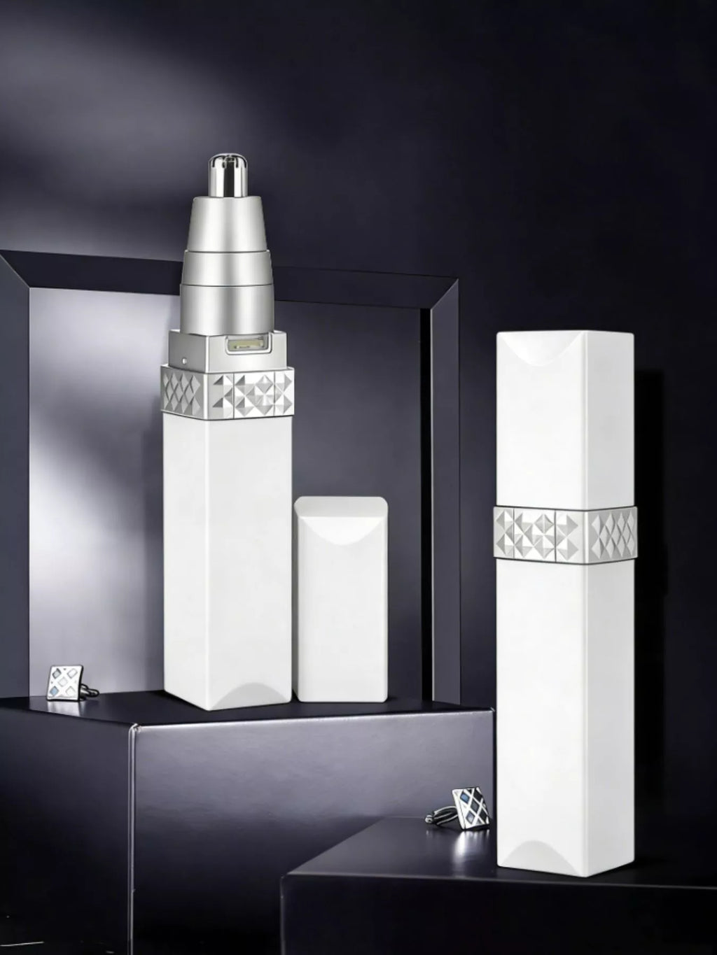 Portable nose hair trimmer, white body with silver top and patterned grip