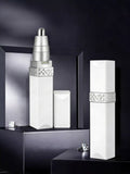 Portable nose hair trimmer, white body with silver top and patterned grip