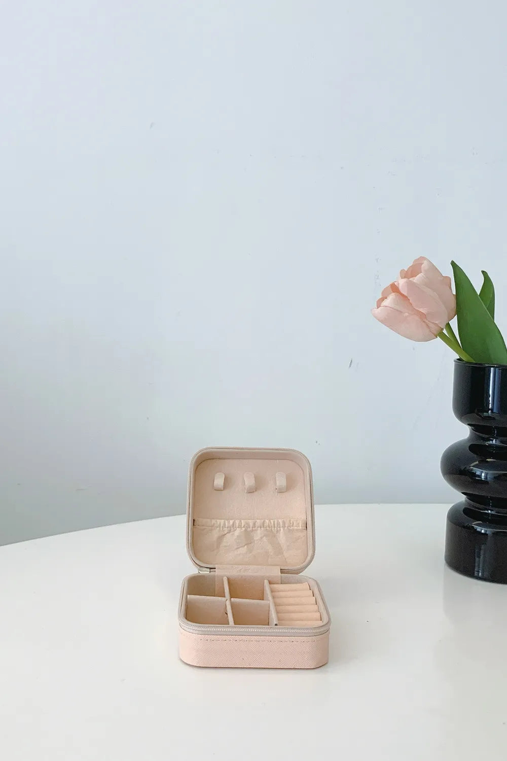 Blush pink PU leather square jewelry box, open lid with earring slots and compartments