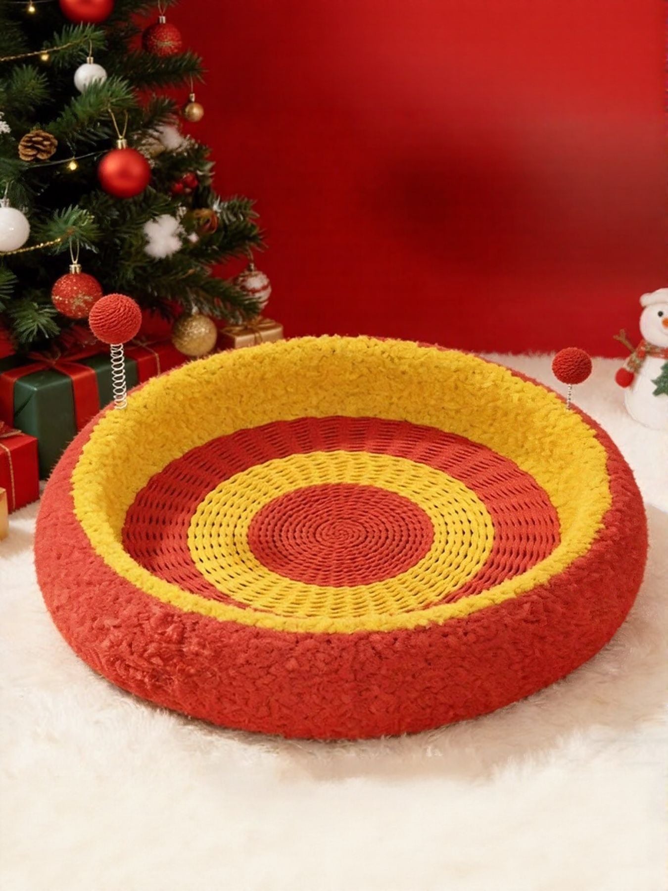 Oval cat scratching bed in red with yellow and red concentric circular woven pattern
