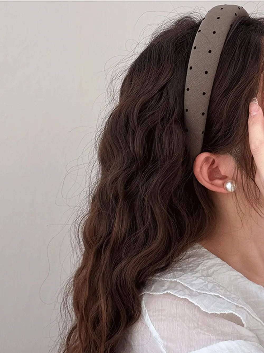 Coffee brown polka dot wide headband worn, black dot pattern