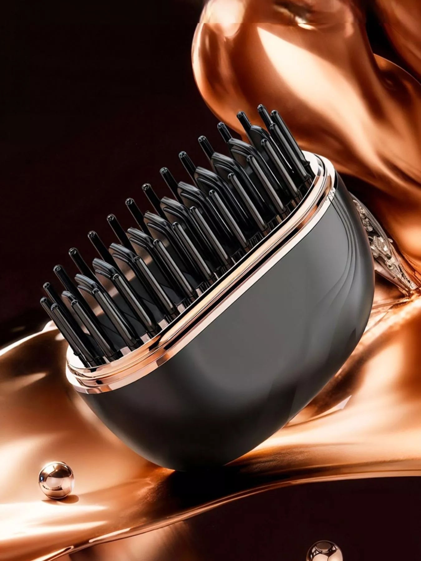 Black heated hair straightening comb with open teeth and rose-gold rim